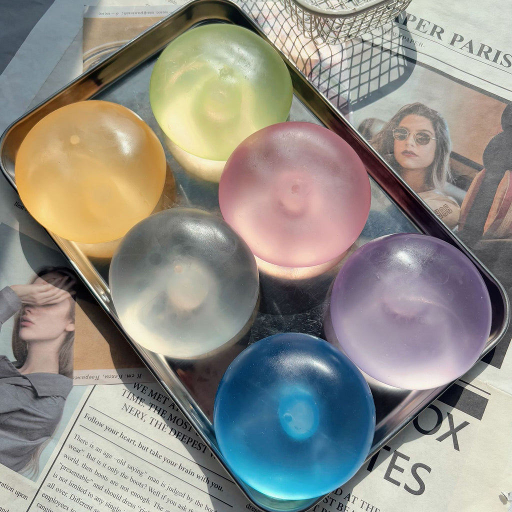 Popular coconut oil squeezeable toy ball, translucent and made of Vaseline, perfect for stress relief. It's malleable, doesn't bounce back, and has a great squishy feel.